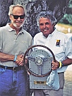 Thos. L. Bryant with Brian Redman accepting R&T Magazine’s &ldquo;The Car We Would Most Like To Race&rdquo; trophy designed and hand-fabricated by Dwight H. Bennett, on behalf of the Collier Automotive Museum.