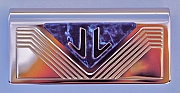 Initials &ldquo;JL&rdquo; on a panel for the interior of a private airplane as hand-pierced by Dwight H. Bennett.