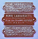 Henri Labourdette Carrossier (Coach) Plate reproduction, and a &ldquo;Buess Labourdette&rdquo; modified coach plate, both hand-fabricated by Dwight H. Bennett.