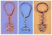 Chain-Pendant Key Rings:  14K Gold Jaguar Bas-Relief, Sterling Silver Lotus and 14K Gold Porsche designed and produced by Dwight H. Bennett.